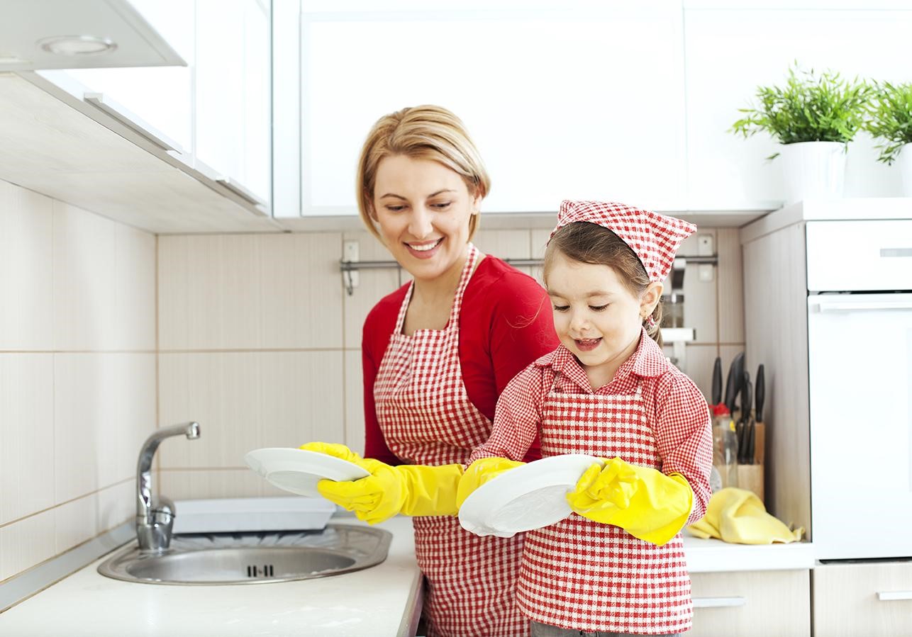 mother and daughter washing dishes